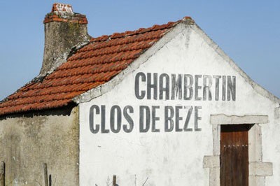A small, rustic house with the words 'Chambertin Clos de Beze' written on it.
