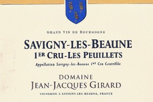 A close-up of a Burgundy premier cru wine label from Domaine Jean-Jacques Girard