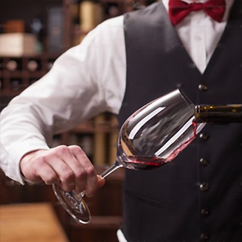 Four wine glasses stand side-by-side. On the left are two glasses filled with red wine. On the right are two glasses filled with white wine. Shop burgundywine.com for exceptional, small-production Burgundy wine.